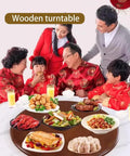 Family gathered around 33 Inch Heavy Duty Wooden Lazy Susan Turntable, sharing dishes and enjoying dinner.