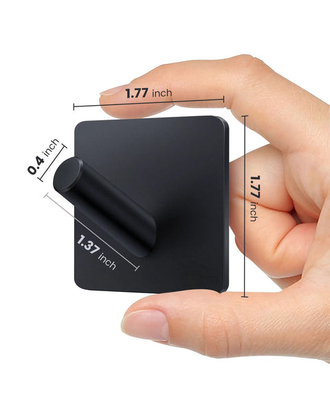 Hand holding black Heavy Duty Self Adhesive Wall Hook 1.77 inch size, matte stainless steel, no punch installation