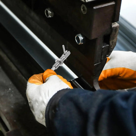 User holding Rock Solid Stainless Steel Spring Plunger Pin With L Shaped Handle For Industrial Gear And Shops on a machine.