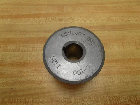L-1501.125 Jaw Coupling With 1.125 Inch Bore And 3.75 Inch Outer Diameter on wooden surface
