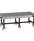 Heavy Duty Mobile Welding Fixture Table With Precision Hole Grid And Smooth Swivel Casters Solid Steel Fabrication Workbench 96 By 48 Inches, viewed from side angle.