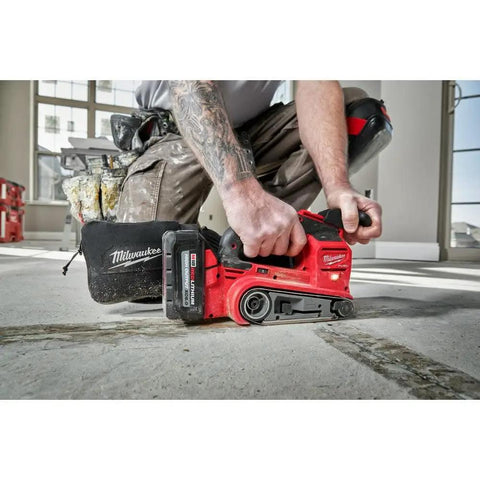 Tough As Nails Cordless Belt Sander With 3X18 Wide Sanding Path And Beefy Brushless Motor For Kickin Up Dust Faster With Slick Variable Speed And Smooth Zero Vibration Control in use on a floor.