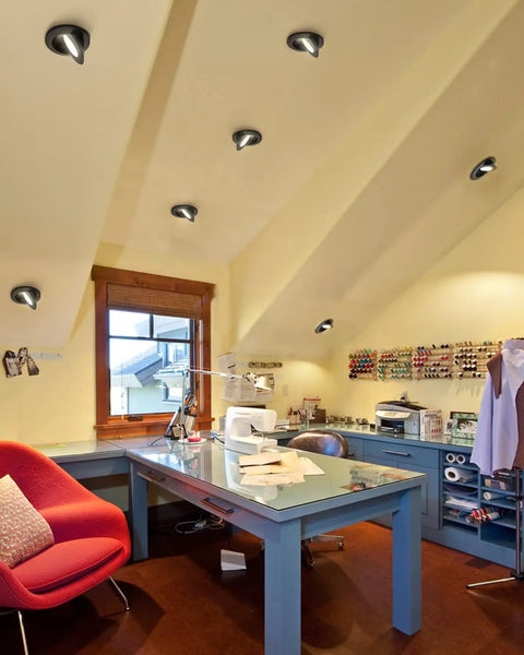 Office space with 4 Inch Gimbal LED Recessed Lights Dope 5CCT Dimmable Eyeball Can Lights With J Box Black installed on sloped ceiling.