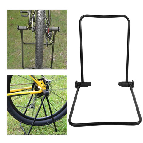 Aluminum Bike Trainer Stand With Storage Rack For Mountain Road And Folding Bikes Adjustable Repair Stand Durable Rust Proof Maintenance Station For Home Garage And Workshop Area shown with bike wheel attachment.