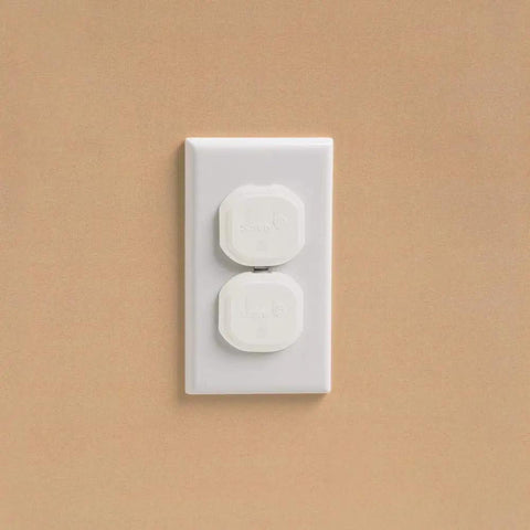 Electrical outlet with white covers from Home Safety Essentials Kit For Kids With 46 Pieces Including Door Knob Covers And Cabinet Latches