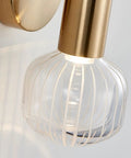 Close-up of Snazzy Slick Led Wall Sconces For Modern Home Refresh Up And Down Adjustable Glass Shade with gold accent.