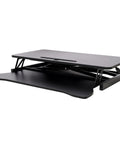 31.5 Inch Height Adjustable Standing Desk Converter Featuring Ergonomic Keyboard Tray And Monitor Riser shown in black finish from the side view.