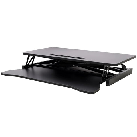 31.5 Inch Height Adjustable Standing Desk Converter Featuring Ergonomic Keyboard Tray And Monitor Riser shown in black finish from the side view.