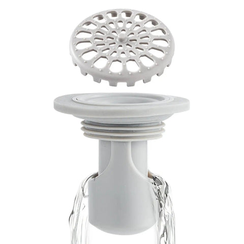 Odor Stopper for Shower - Anti-Odor Mini Bottle Trap Design with removable top and clear body for efficient odor prevention.