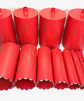12 piece Pro Series diamond wet core bit set for Badass 12 Inch Concrete Core Drill Rig, red metal construction, various sizes.
