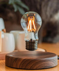 Levitating Bulb Lamp With Magnetic Floating Light For Home Office And Desk Decor on wooden base glowing softly.