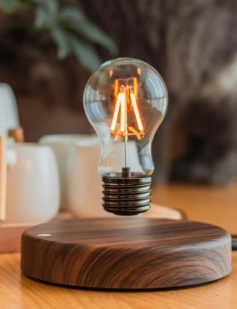 Levitating Bulb Lamp With Magnetic Floating Light For Home Office And Desk Decor, displayed on a wooden surface.