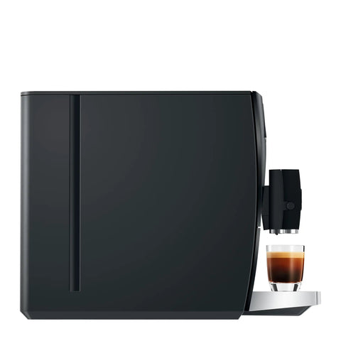 Top Tier Automatic Coffee Maker In Sleek Piano Black With One Touch Brewing For Barista Style Espresso and creamy latte blends made daily without the sweat, showcasing side view with espresso.