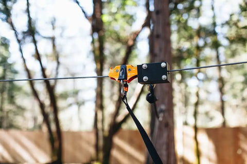 60Ft Zipline Brake System With Heavy Duty Bungee Cords And Plastic Brake Block installed on a zipline among trees