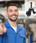Friendly mechanic in blue coveralls with a Heavy Duty Universal Hub Puller For Brake Drum Removal And Seized Bearing Extraction Four And A Half Inch Jaw Opening Tough Carbon Steel.