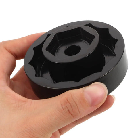 Precision Machined Axle Nut Socket Set for Front and Rear Wheel Hubs held in hand, showing hex inner wall design.