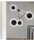 Top Shelf Round Led Wall Sconce Lighting For Bedroom Bedside Decor Featuring Smooth 360 Degree Rotation Matte Black Iron Industrial Loft Fixture Serving Clean Soft Glow on modern wall.