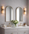 GLEAMING NEST Modern Alabaster Wall Sconce, Double Light Fixture, Antique Brass Finish, Fluted Stone Shades illuminating a bathroom vanity.
