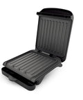 Ovente Two Serving Electric Indoor Grill And Panini Press Compact Contact Maker For Juicy Steaks Bold Smoky Flavor No Outdoor Mess Black Kitchen Appliance open, nonstick surface.