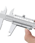Vernier Caliper 6 Inch Non Digital Measuring Tool With Inside Outside Depth And Step Measurements High Precision Caliper 0.02mm 0.001 Inch Ideal For Metalworking And DIY Projects Durable Carbon Steel Construction, close-up of 6-inch carbon steel vernier caliper with hand