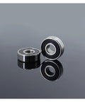 Pro Grade 608 2RS Hybrid Ceramic Bearings With Abec 7 Precision An 8 Pack Sized At 8X22X7MM For Skateboards And Roller Skates on reflective surface.