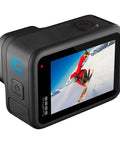 HERO10 Black Must Have Accessory Bundle With Shorty Mini Extension Pole And Grip Magnetic Swivel Clip Two Rechargeable Batteries And Durable Camera Case For Action Cameras showing a skier on screen.