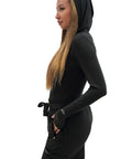 Women's Hooded Underscrub Shirt For Healthcare Pros Black Nurse Jacket with slim tailoring, soft breathable material, side view.