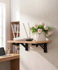 Slick Folding Wall Mounted Projector Shelf In Solid Natural Wood, Compact Floating Bracket For Routers And Cable Boxes, showcasing a rustic wood shelf with decor.