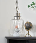 Set Of Three Hammered Cylinder Glass Shade Pendant Lights For Bathroom Vanity And Chandelier Upgrade In Modern Water Glass Design 6 Inch By 5 Inch Shades That Fit Threaded Medium Base Sockets Perfect For Any Home shown hanging in room