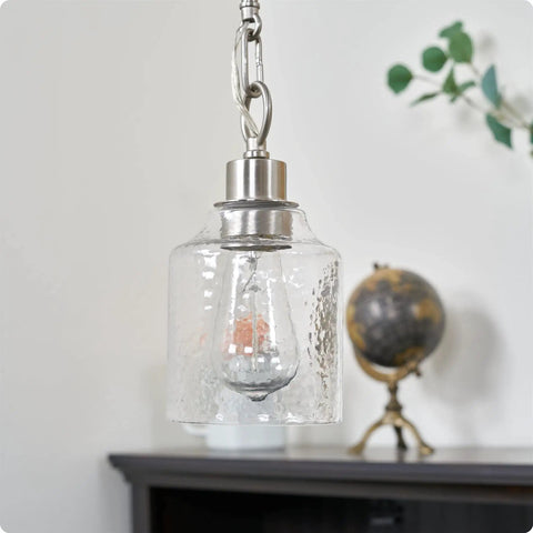 Set Of Three Hammered Cylinder Glass Shade Pendant Lights For Bathroom Vanity And Chandelier Upgrade In Modern Water Glass Design 6 Inch By 5 Inch Shades That Fit Threaded Medium Base Sockets Perfect For Any Home shown hanging in room