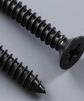 Close-up of black Dacromet coated screws from Must Have Wood Screws Assortment Kit For Woodworking And DIY Projects, 289 Pieces.
