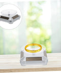 Didiseaon Solar Powered Rotating Jewelry Display Stand Decorative Rack For Watches Necklaces Bracelets Stable Electric Turntable Organizer Bedside Daily Use Auto Spin Light Show showing a gold bracelet on a solar-powered display.