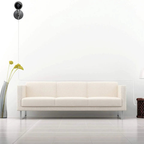 Modern living room with a white sofa and a camera powered by Two Pack 20Ft Power Extension Cable For Indoor And Outdoor Security Cameras Including Wyze Cam V4 V3 Pan OG Nest Cam Blink And Cloud Camera USB To Micro USB Charging And Data Sync Cord Plug And Play