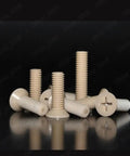 Premium PEEK Plastic Phillips Countersunk Flat Head Screws M6 X 40mm Pack Of Twenty shown in various angles on a reflective surface.