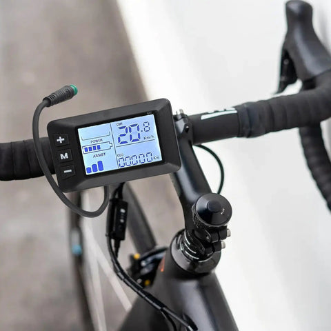 5 Pin E Bike Display For 24V 36V 48V Systems With G51 Color LCD Screen on a bicycle handlebar showing speed and battery status.