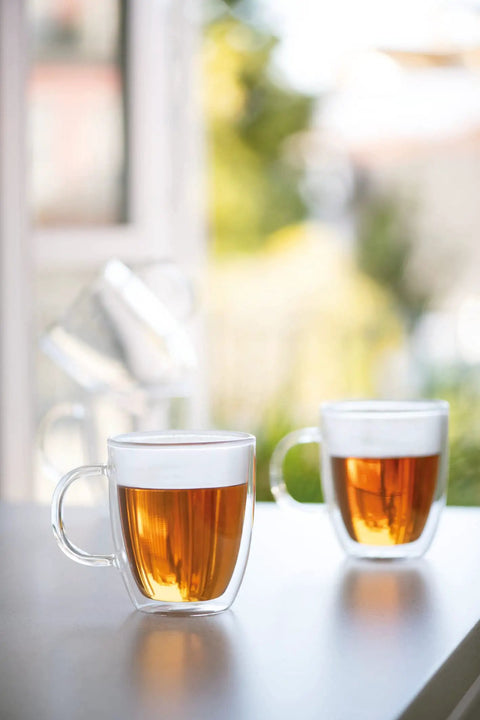 Double Wall Borosilicate Glass Mug Set Of Two Keeps Your Daily Joe Smoking Hot with clear design and amber beverage visible.