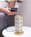 Heavy Hitter Power Strip With Quick Juice USB Ports And No Hassle Surge Guard For Your Home Office Setup on a table next to smartphone.