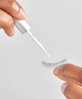 Applying 5 Day Extended Wear Strip Lash Adhesive With Brush Applicator, Quick Dry Lash Glue to strip lash