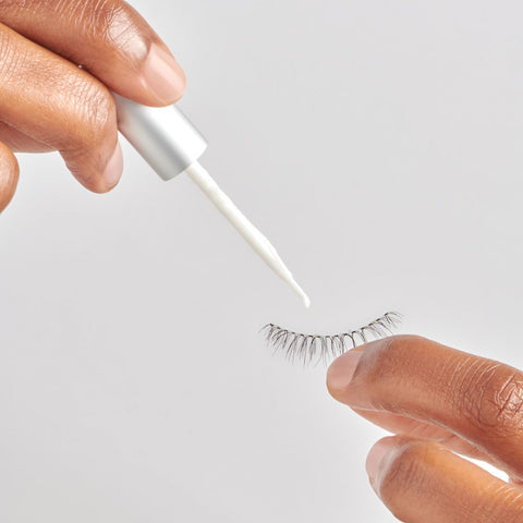 Applying 5 Day Extended Wear Strip Lash Adhesive With Brush Applicator, Quick Dry Lash Glue to strip lash