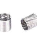 Close-up of threaded inserts from 17 Piece Heavy Duty Stainless Steel Thread Repair Kit With Twisted Drill, Tap Wrench And Threaded Inserts For M10x1 Threads, Restores Beatup Auto Parts, Radiators And Damaged Holes With Strong Durable Inserts.