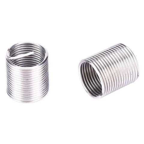 Close-up of threaded inserts from 17 Piece Heavy Duty Stainless Steel Thread Repair Kit With Twisted Drill, Tap Wrench And Threaded Inserts For M10x1 Threads, Restores Beatup Auto Parts, Radiators And Damaged Holes With Strong Durable Inserts.