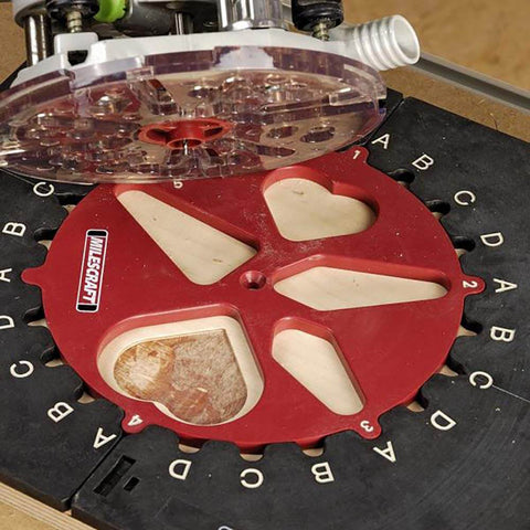 Design And Inlay Router Template Jig Kit For DIY Woodworking With 25 Pattern Ideas Pencil Guide and red template on a wood panel.