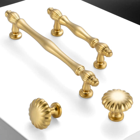 Rad Five Inch Brushed Gold Cabinet Pulls And Drawer Handles built with solid metal shown at various angles on a white surface.
