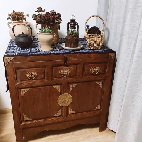 Wooden cabinet with antique brass vintage style pull handles, decorative items on top, suitable for bookcases and wardrobes.