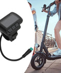 EN06 LCD Display Panel For Electric Bikes With USB Power Real Time Speed And Battery Readout Waterproof Connector alongside a scooter