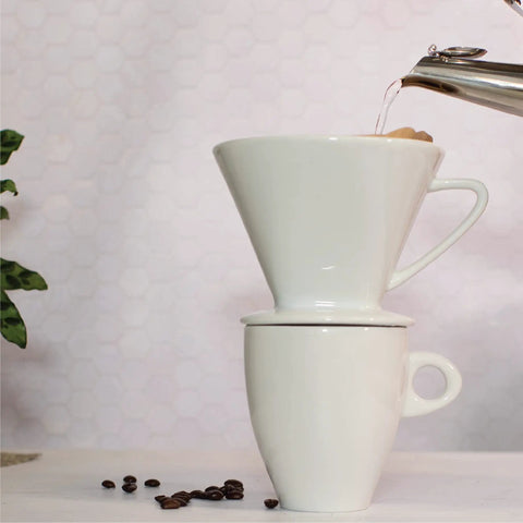 Pouring water into Porcelain Coffee Dripper Size Four, White Ceramic, Manual Pour Over Filter Holder For Smooth Drip Coffee