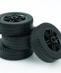 Four Piece Tech Wheels And Tires Set With 43.2x14mm Tires And 30x14mm Rims For RC Cars, stacked four black wheels.