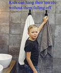 Child using Matte Black Heavy Duty Wall Mount Hooks For Towels Robes And Coats, Non Slip Bath And Kitchen Hooks in bathroom