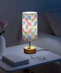 Watercolor Monstera Leaf Palm Decor Bedside Lamp With Three Way Dimmable Touch Control And Built In Charging Station on nightstand