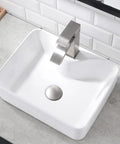 White Rectangle Ceramic Bathroom Vessel Sink And Brushed Nickel Waterfall Faucet Combo on counter with tile wall background